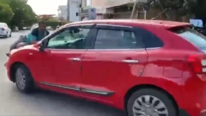 Man dragged on car bonnet Man dragged on car bonnet